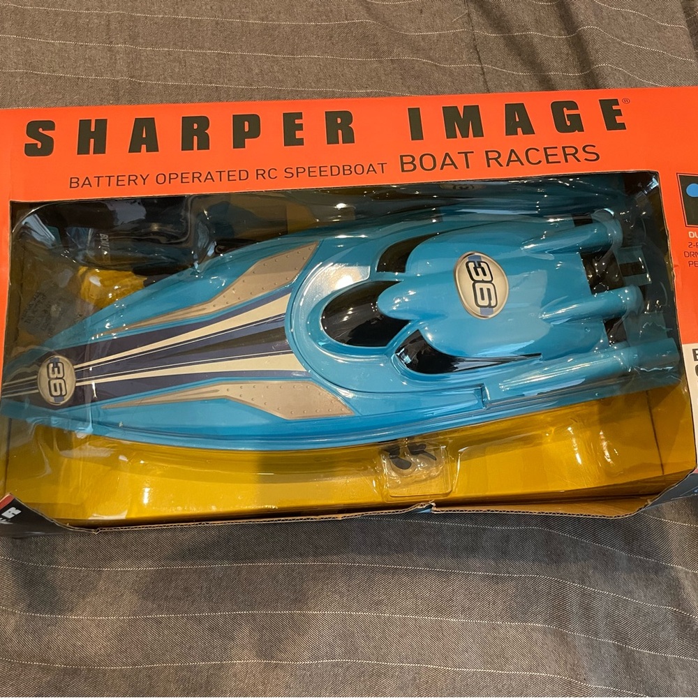 NEW sharper image RC boat racer